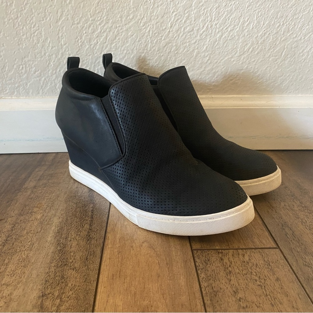 Black and white Susina wedge shoes.